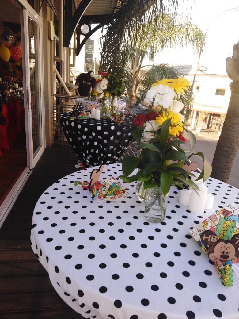 Decorated cocktail tables with flowers on the balcony